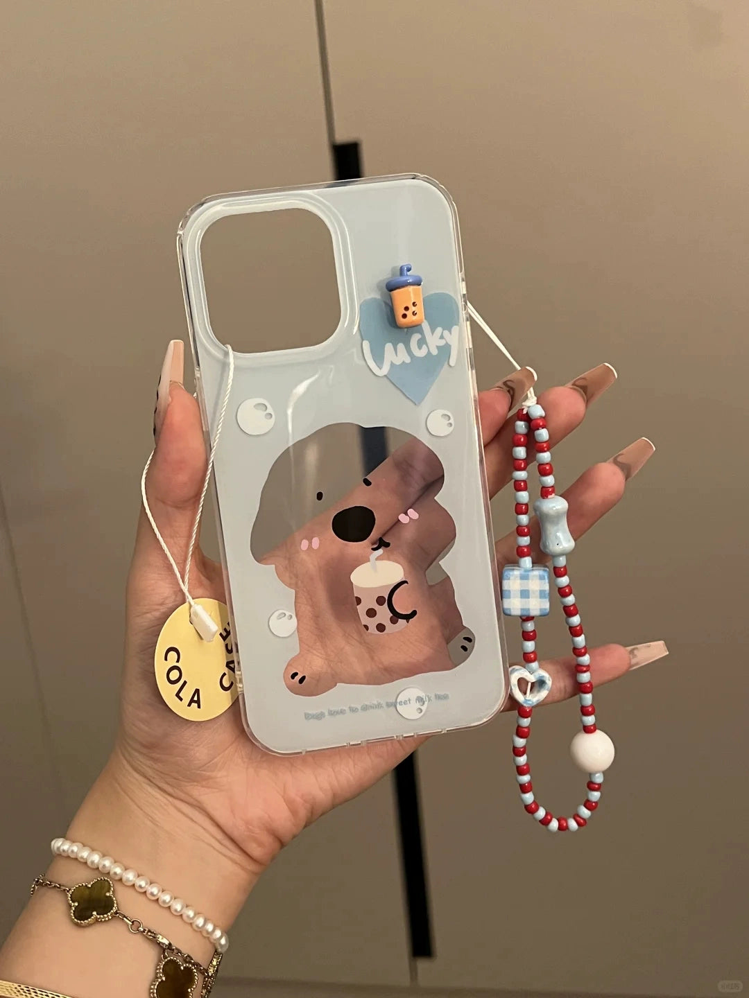 Dog Drinking Milk Tea Illustration Hollow Cute Mobile Phone Case with Mobile Phone Chain Pendant Suitable for iPhone16 iPhone15 iPhone14 iPhone13